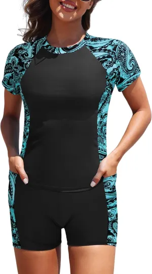 Daci Women's Two Piece Rash Guard - Short Sleeve Swim Shirt with Built-in Bra and Shorts with Pockets