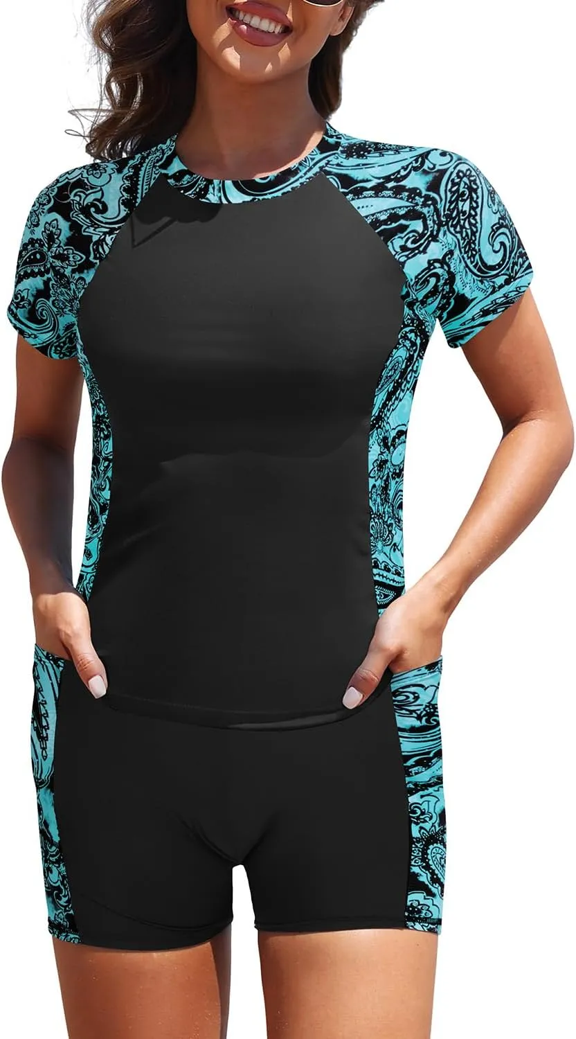 Daci Women's Two Piece Rash Guard - Short Sleeve Swim Shirt with Built-in Bra and Shorts with Pockets